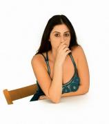 A Woman Hiding Her Mouth