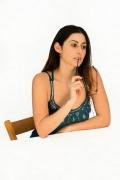 A Woman Putting An Object In Her Mouth